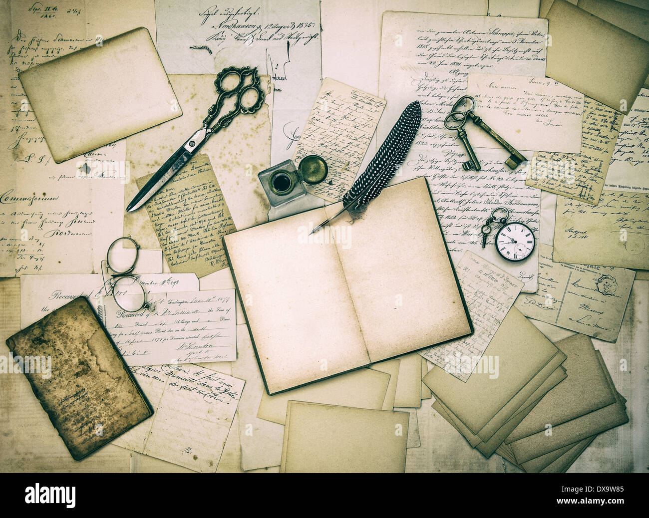 antique accessories, old letters and vintage ink pen. nostalgic sentimental paper background toned and textured Stock Photo