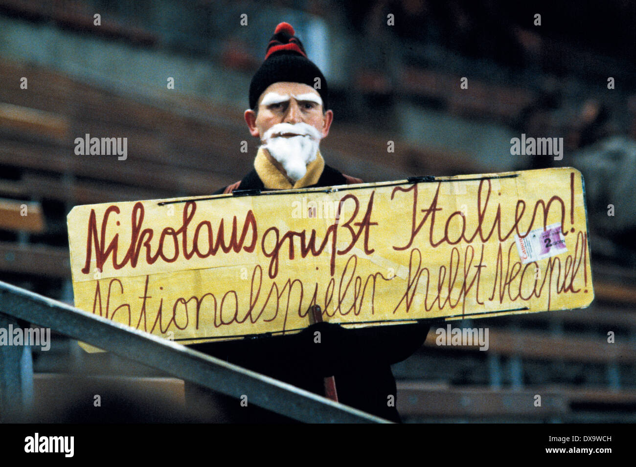 football, Bundesliga, 1980/1981, Rhine Stadium, Fortuna Duesseldorf versus 1. FC Cologne 0:0, Fortuna football fan disguised as Santa Claus reminds of the earthquake victims in Naples, Italy, demand for help to the international football players Stock Photo
