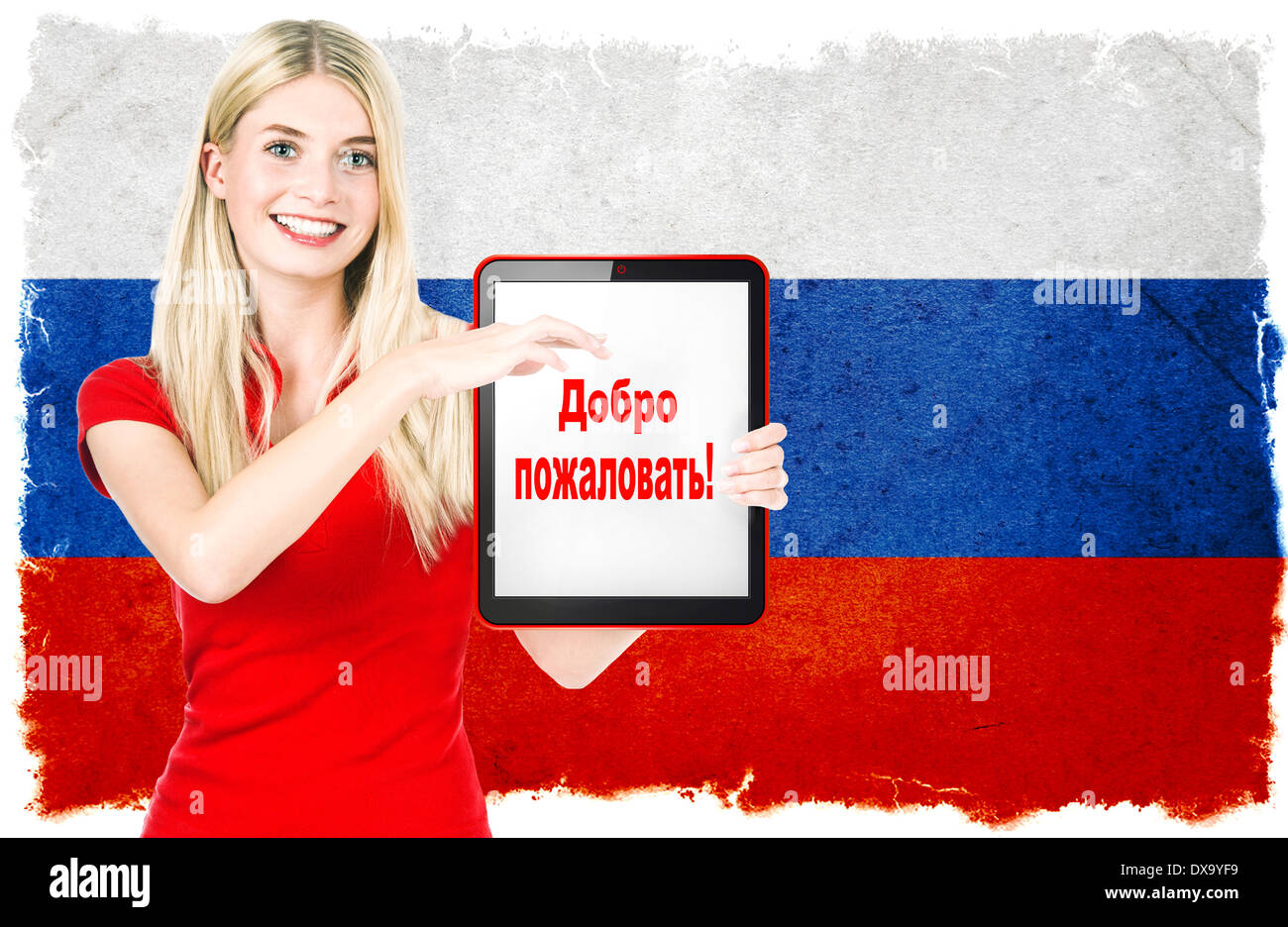young woman with russian national flag on the background holding tablet pc. with sample text in russian language WELCOME! Stock Photo