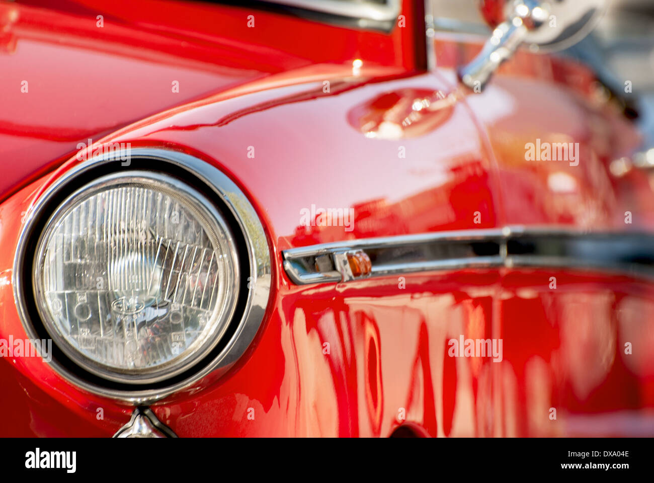 Front view of a shiny red vintage car. Stock Photo