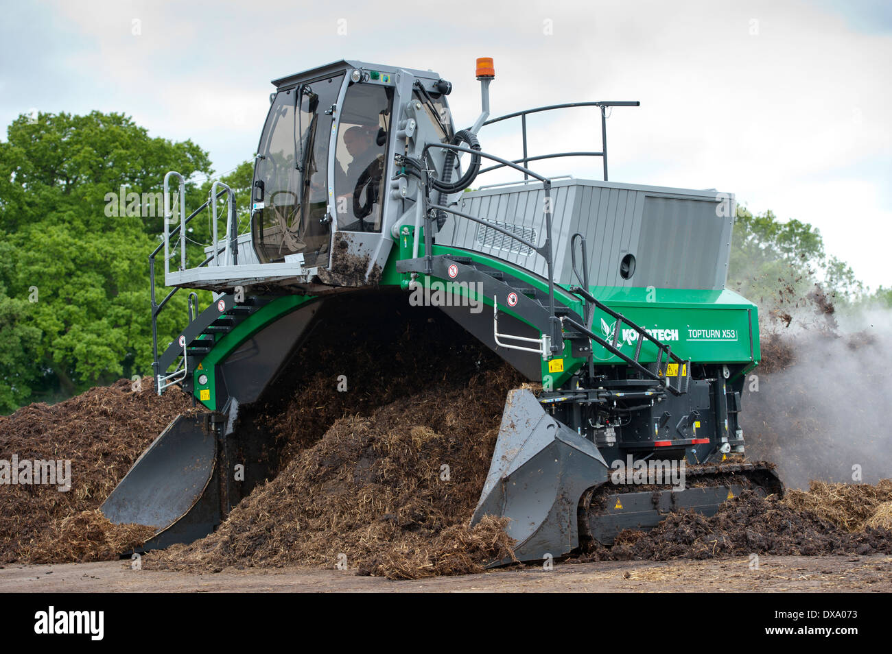 Komptech self propelled compost turner, turning over rotting bedding manure Stock Photo Alamy