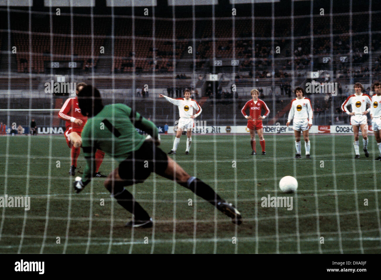 football, Bundesliga, 1981/1982, Rhine Stadium, Fortuna Duesseldorf versus 1. FC Kaiserslautern 4:2, scene of the match, Hans-Peter Briegel (FCK) left covered scores the 3:2 goal by penalty resulting from a foul, keeper Horst Dreher (Fortuna) is chanceles Stock Photo
