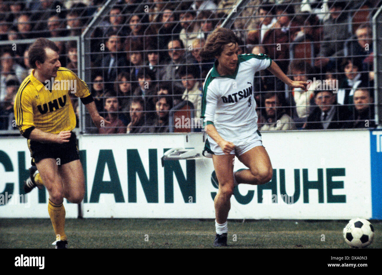 football, Bundesliga, 1981/1982, Stadium am Boekelberg, Borussia Moenchengladbach versus Borussia Dortmund 0:1, scene of the match, Frank Mill (MG) in ball possession, left Lothar Huber (BVB) Stock Photo