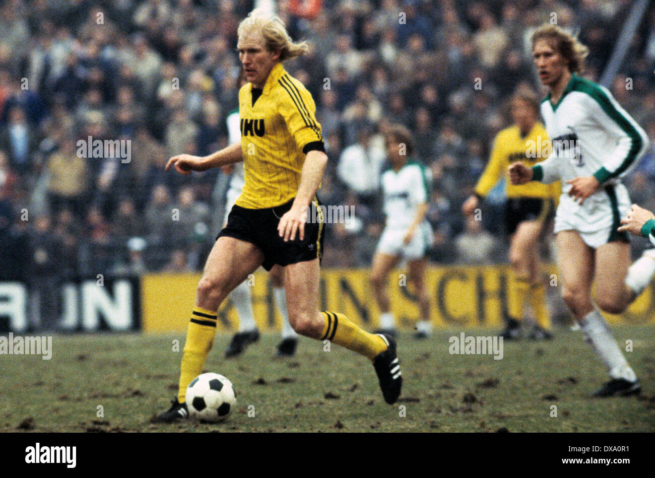 football, Bundesliga, 1981/1982, Stadium am Boekelberg, Borussia Moenchengladbach versus Borussia Dortmund 0:1, scene of the match, Rolf Ruessmann (BVB) in ball possession, right Uwe Rahn (BVB) Stock Photo