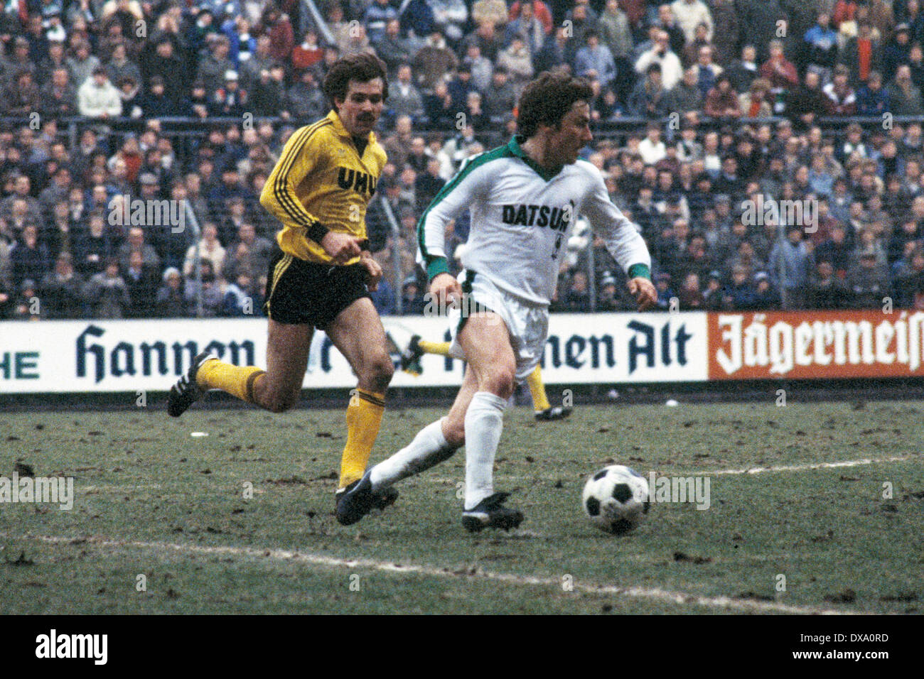 football, Bundesliga, 1981/1982, Stadium am Boekelberg, Borussia Moenchengladbach versus Borussia Dortmund 0:1, scene of the match, Wolfram Wuttke (MG) in ball possession, left Miroslav Votava (BVB) Stock Photo
