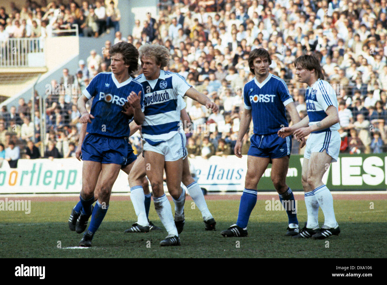 football, Bundesliga, 1981/1982, Wedau Stadium, MSV Duisburg versus VfL Bochum 1:0, scene of the match, f.l.t.r. Christian Schreier (VfL), Dietmar Schacht (MSV), Heinz Knuewe (VfL), Franz-Josef Steininger (MSV) Stock Photo