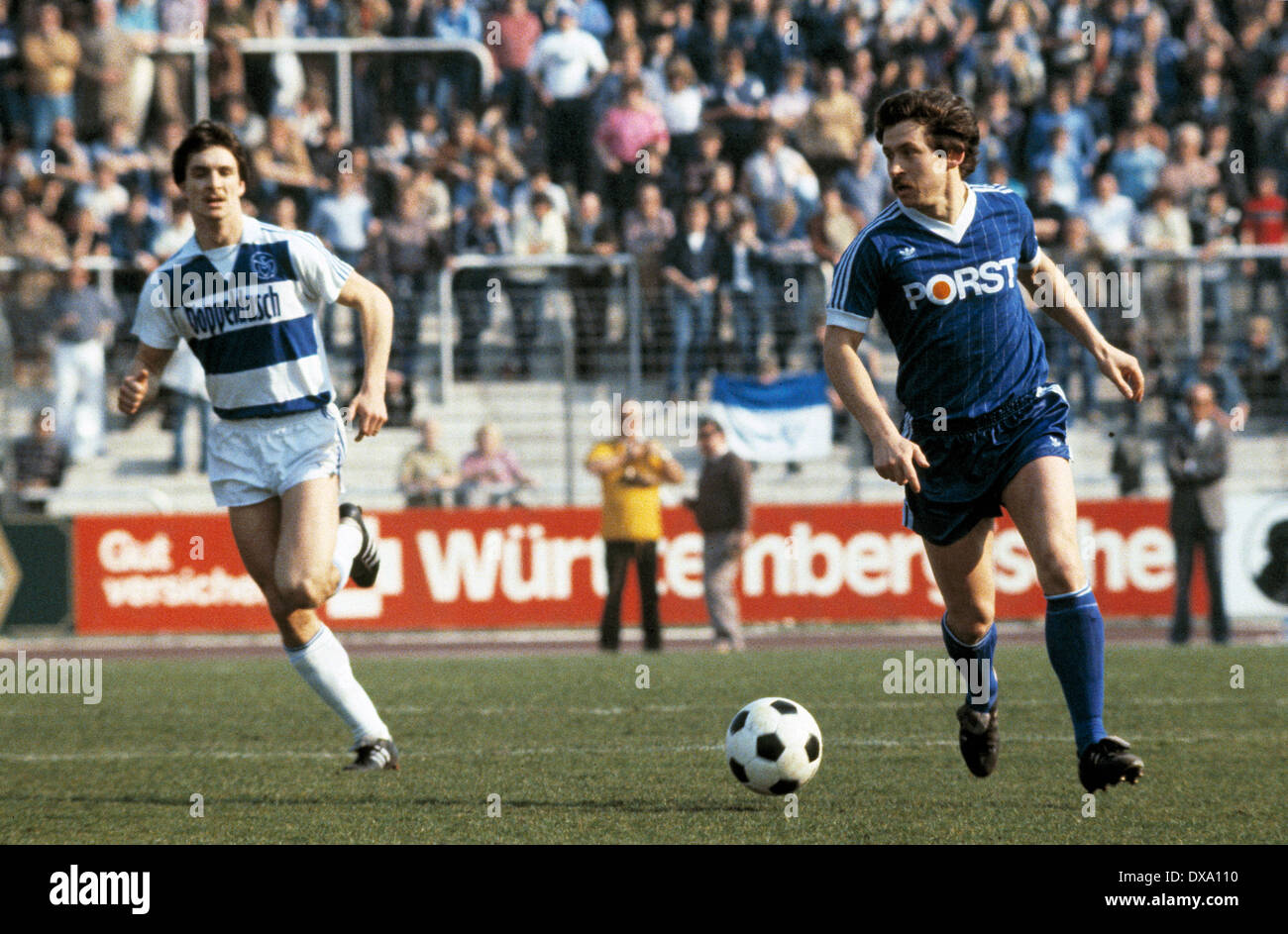 football, Bundesliga, 1981/1982, Wedau Stadium, MSV Duisburg versus VfL Bochum 1:0, scene of the match, Dieter Bast (VfL) in ball possession, left Thomas Kempe (MSV) Stock Photo