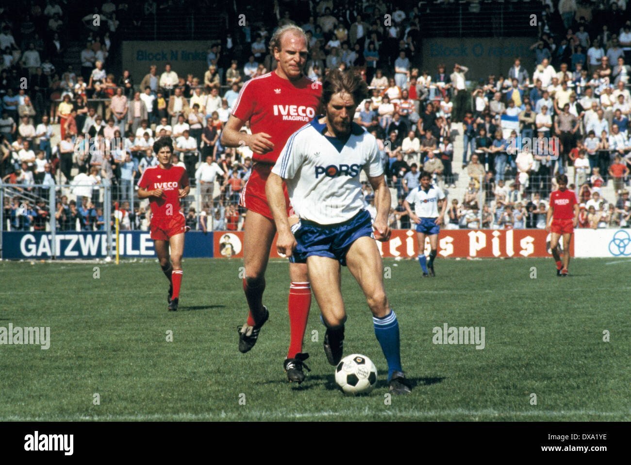 football, Bundesliga, 1981/1982, Ruhr Stadium, VfL Bochum versus FC Bayern Munich 3:1, scene of the match, Lothar Woelk (VfL) in ball possession, behind Dieter Hoeness (FCB) Stock Photo