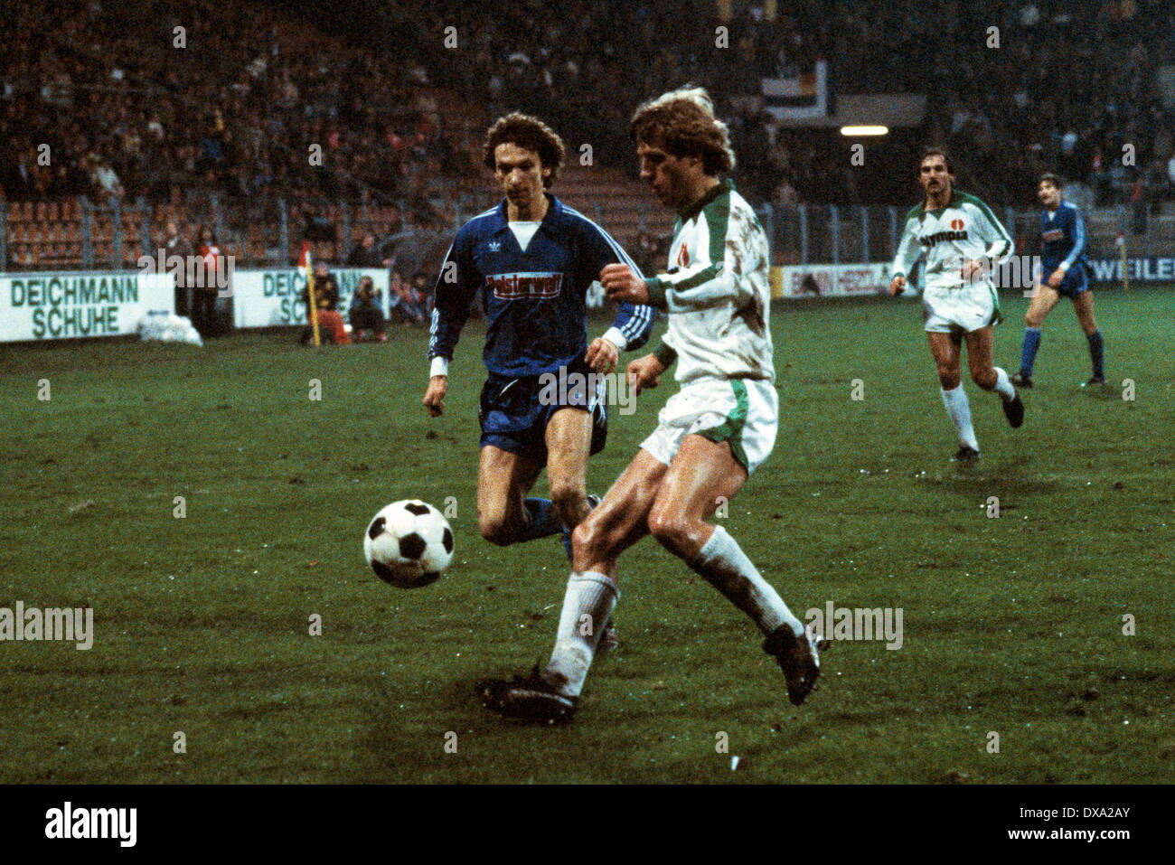 football, Bundesliga, 1982/1983, Ruhr Stadium, VfL Bochum versus SV Werder Bremen 1:2, scene of the match, f.l.t.r. Reinhold Zagorny (VfL), Klaus Fichtel (Werder), Jonny Otten (Werder) Stock Photo
