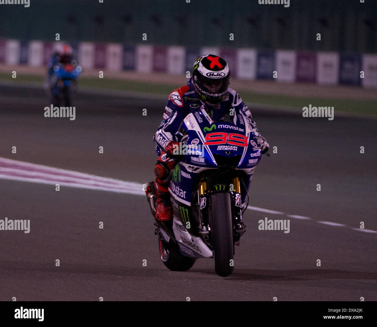 Losail Circuit, Qatar. 20th March 2014.  Jorge Lorenzo the Yamaha Factory Racing rider leaves the Losail Pit Lane on his Yamaha YZR-M1 for free practice session on the 2014 FIM MotoGP World Championship Credit:  Tom Morgan/Alamy Live News Stock Photo