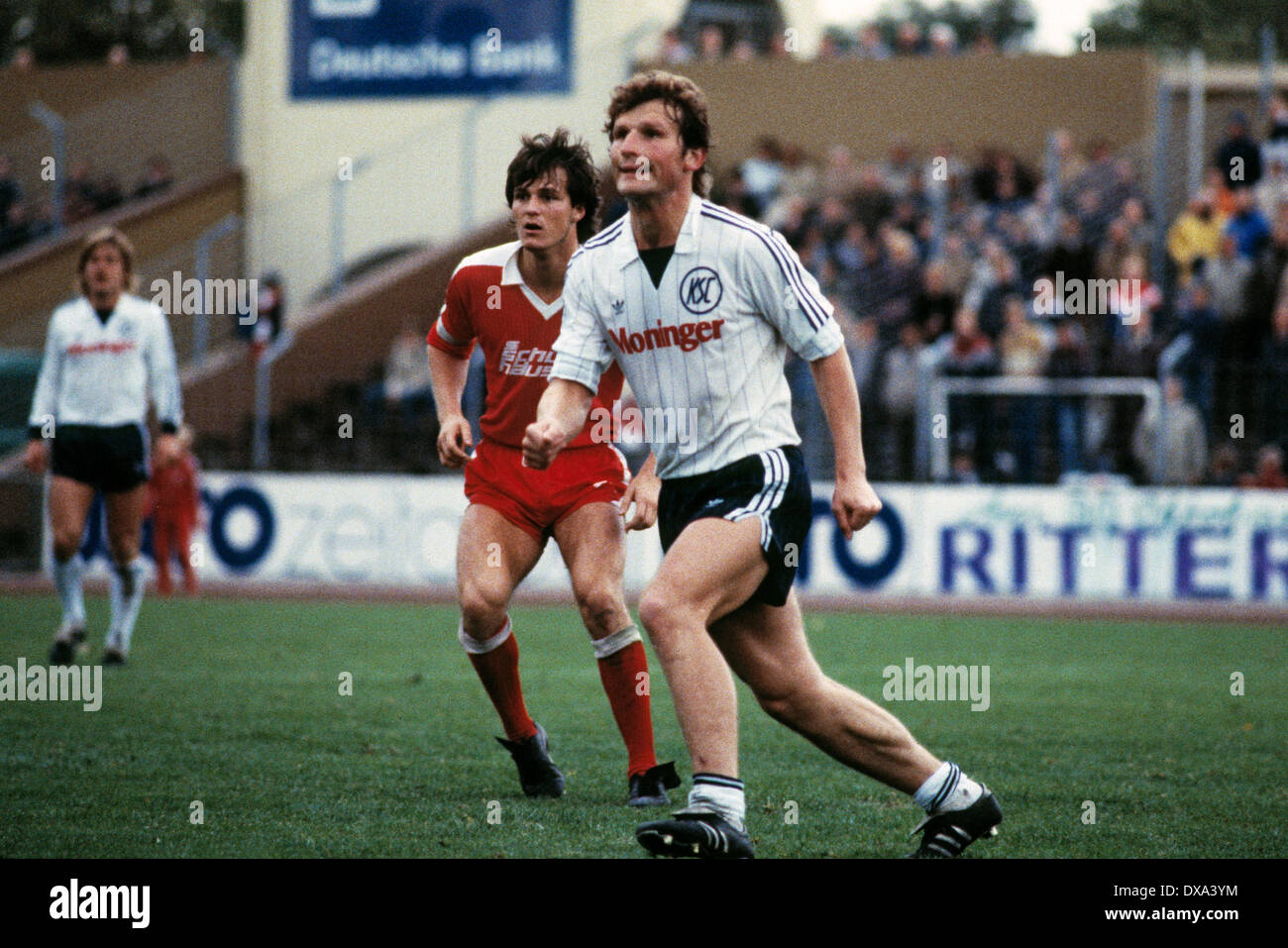 football, 2. Bundesliga, 1983/1984, Niederrhein Stadium, Rot Weiss  Oberhausen versus Karlsruher SC 1:0, scene of the match, Stephan Gross  (KSC) ahead and Konrad Eickels (RWO Stock Photo - Alamy