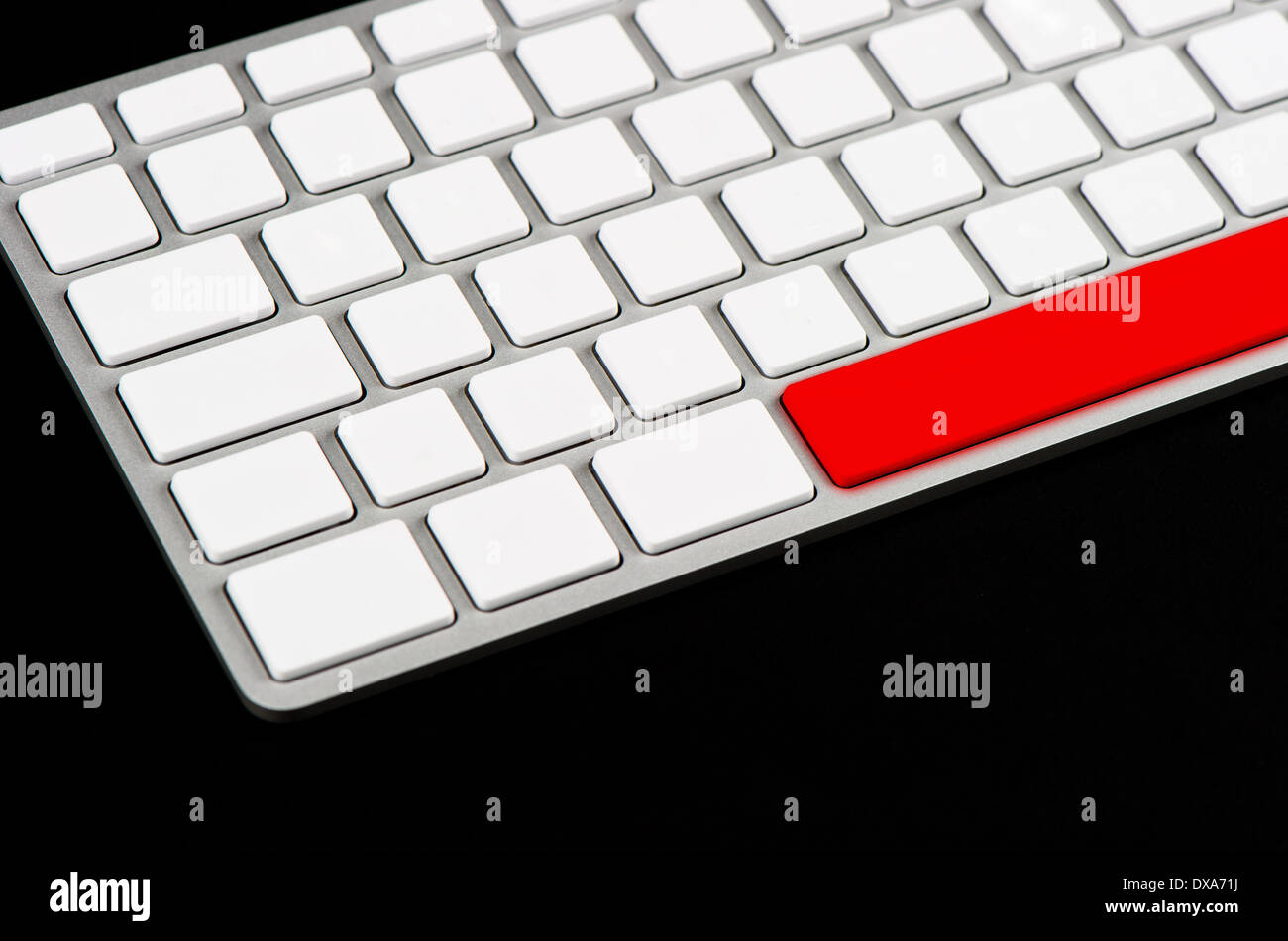 white blank keyboard with red button on black background Stock Photo