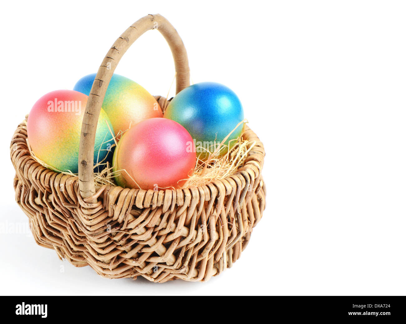 Colorful painted easter eggs in wicker basket Stock Photo - Alamy