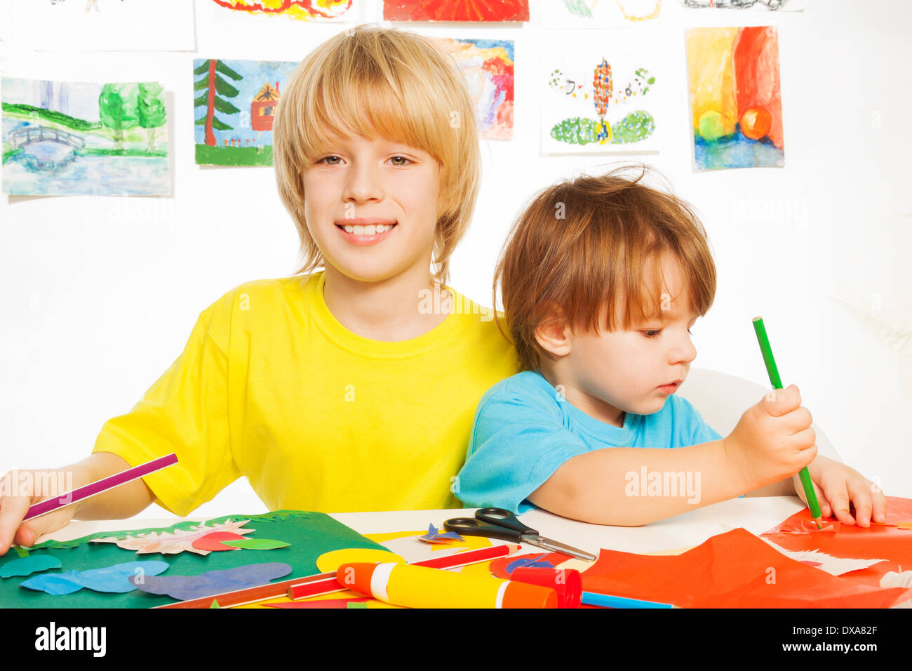 Boy Using Paper Little happy boys play with paper Stock Photo - Alamy