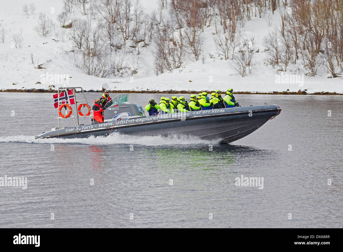 Speedboat with tourists wearing floatation suits, Raftsund, Lofoten, Norway Stock Photo