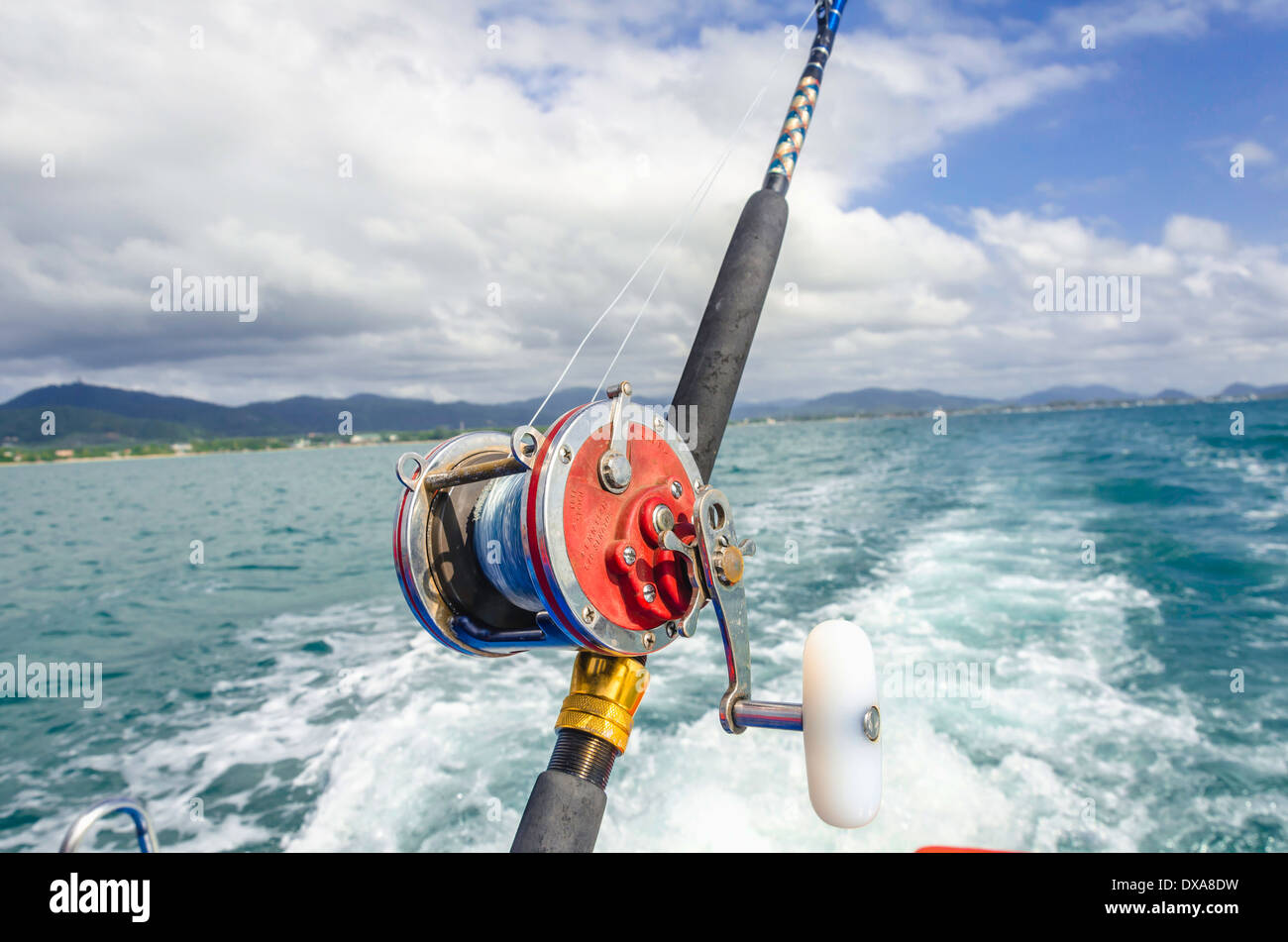Close up of deep sea reel and handle rod Stock Photo - Alamy