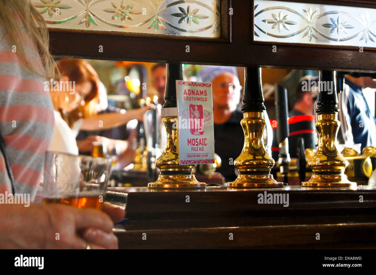 Interior of an English pub, Travellers Friend, ('The Spivs'), Woodford Green, Essex, England showing bar and handpumps Stock Photo
