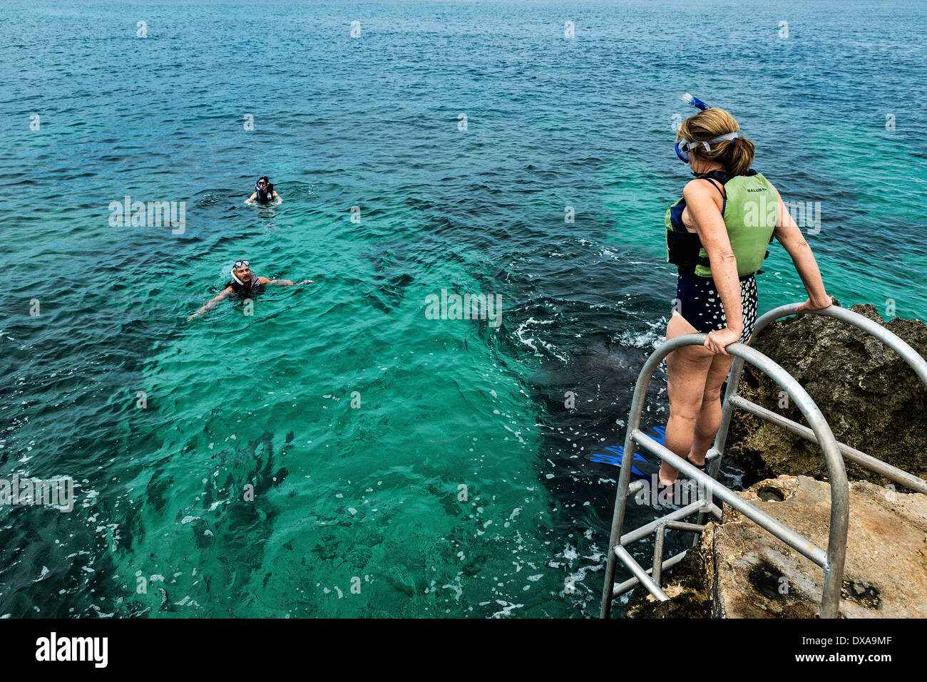 Snorkeling in the tropical aqua waters of Negril, Jamaica. Stock Photo