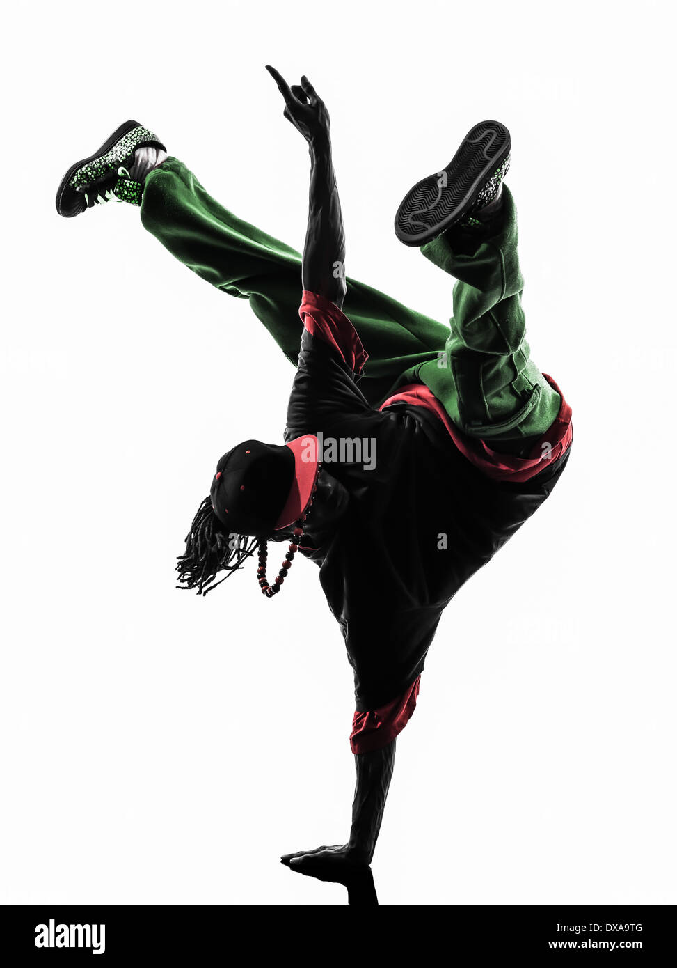 one hip hop acrobatic break dancer breakdancing young man handstand silhouette white background Stock Photo