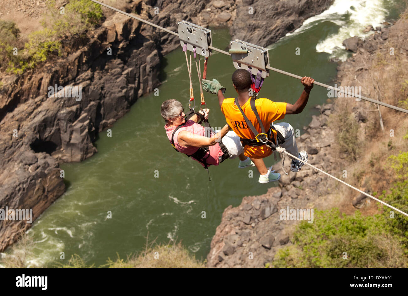 Woman and instructor on Zambezi high wire cable swing Victoria
