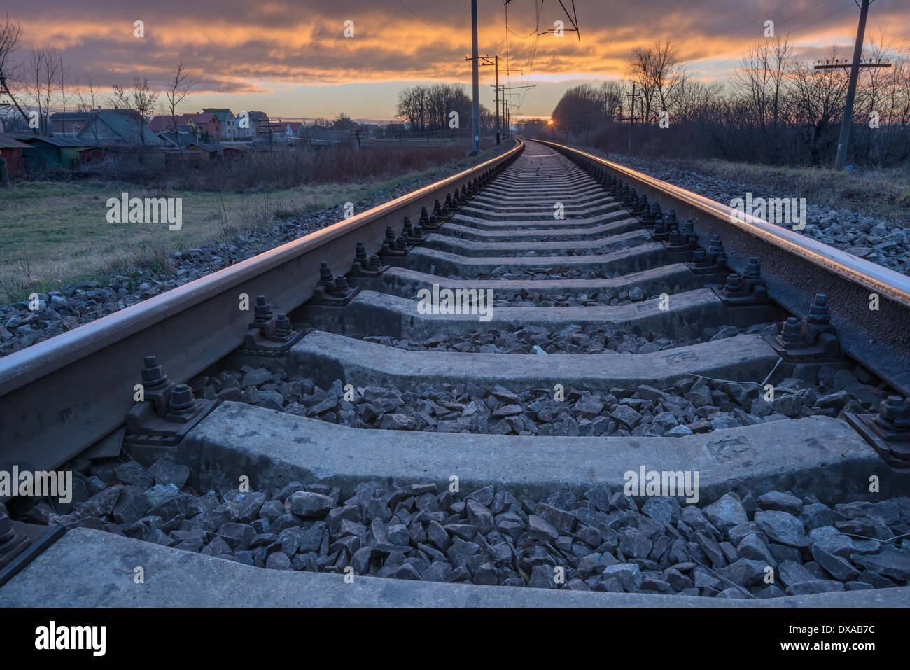 metal railway and orange sunset Stock Photo