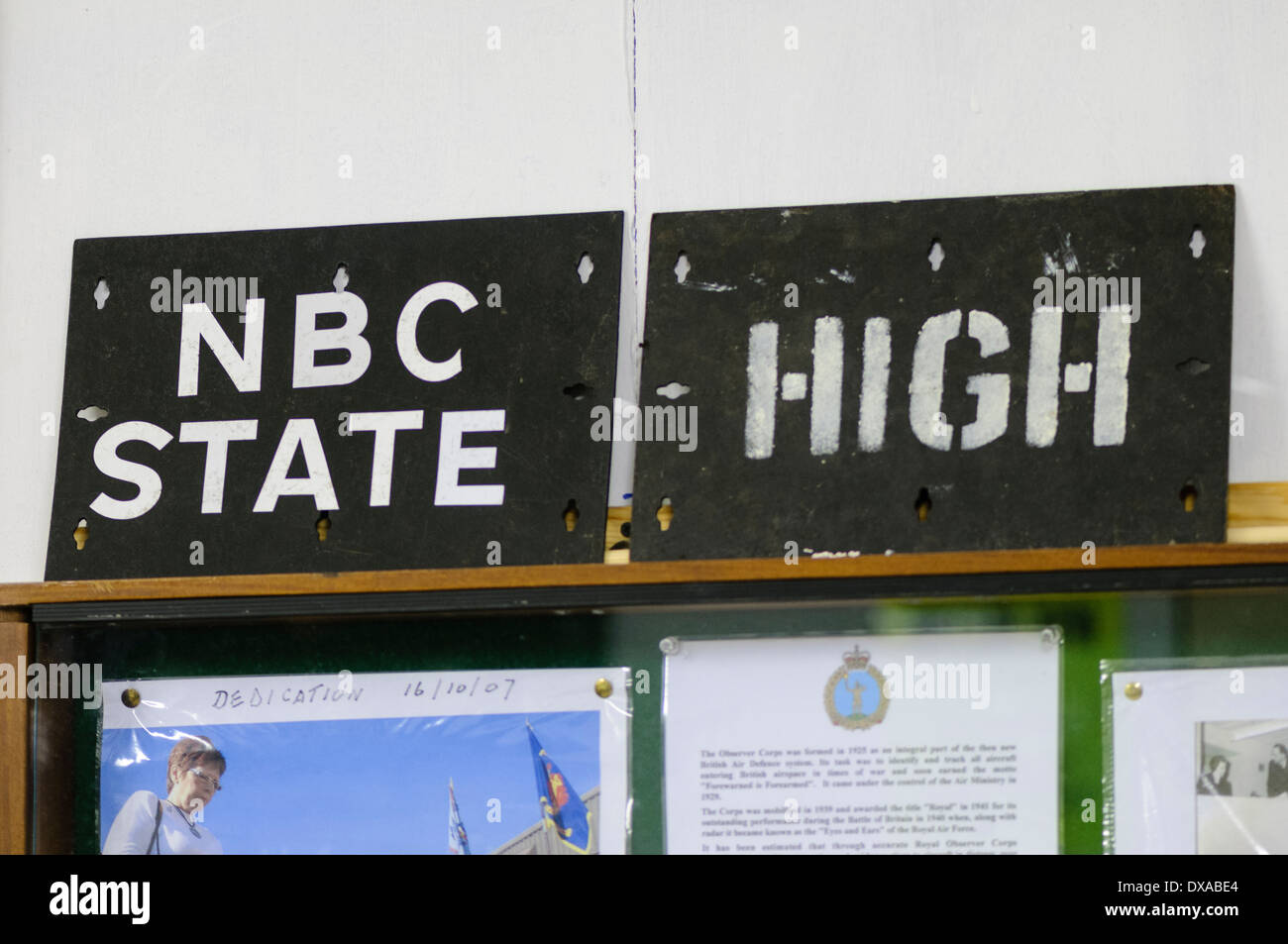 Sign warning that the NBC (Nuclear, Biological Chemical) status is 'High' inside a cold war nuclear bunker Stock Photo