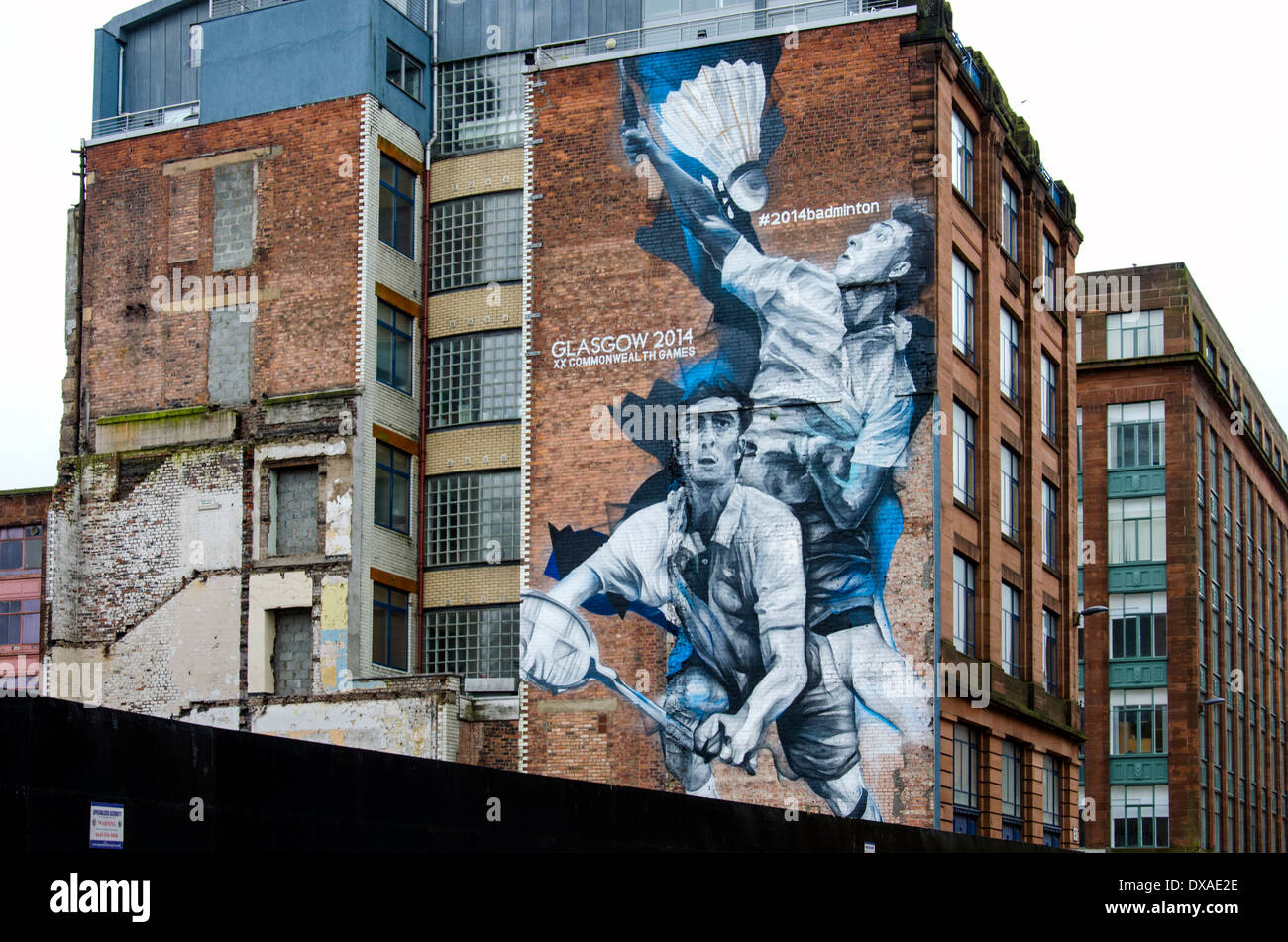 Mural by Guido van Helten depicting two badminton players on a building in Candleriggs area of Glasgow, created for the 2014 Commonwealth Games. Stock Photo