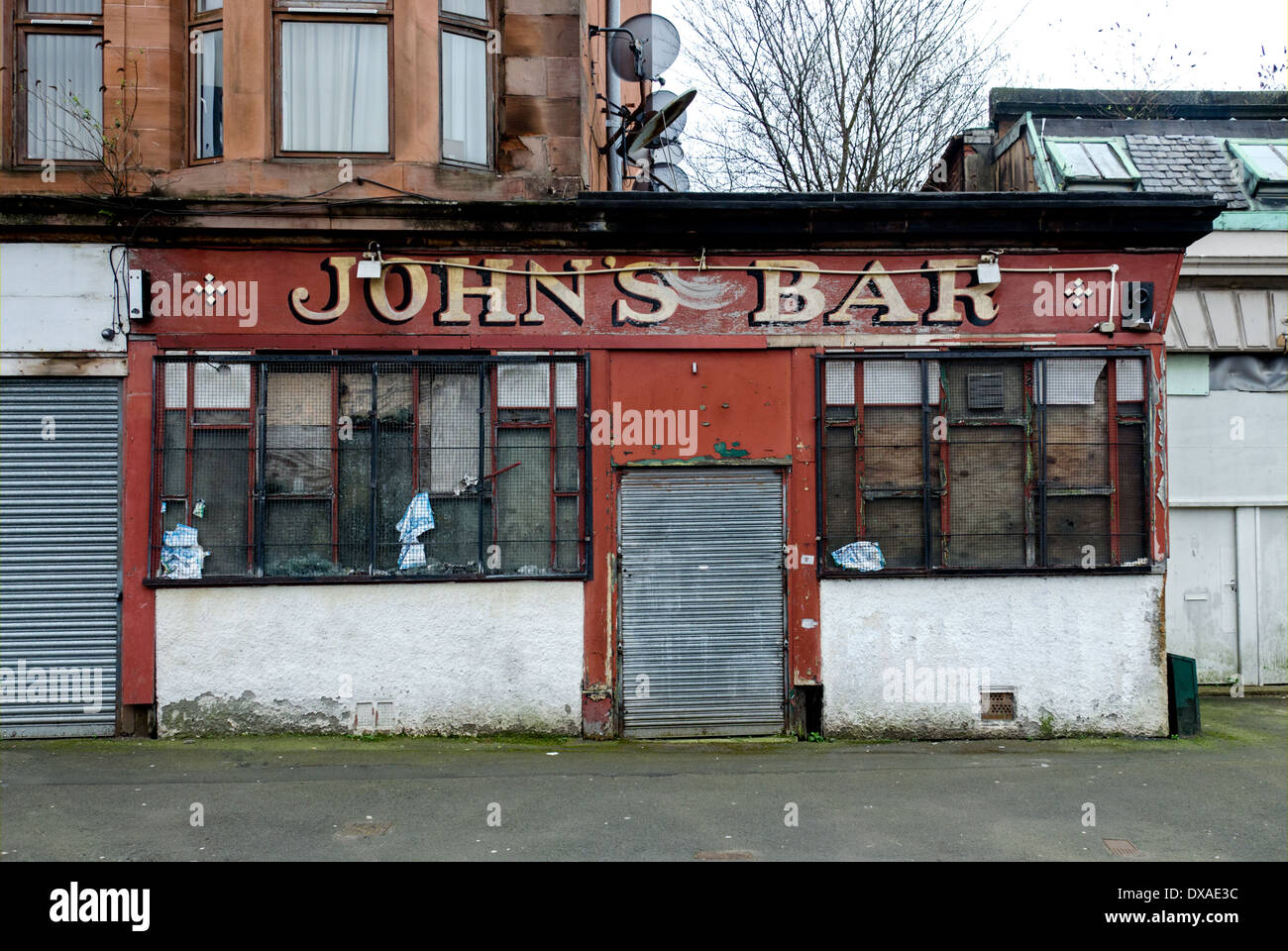 John's Bar, a derelict public house in Tobago Street in the Calton area of Glasgow. Stock Photo