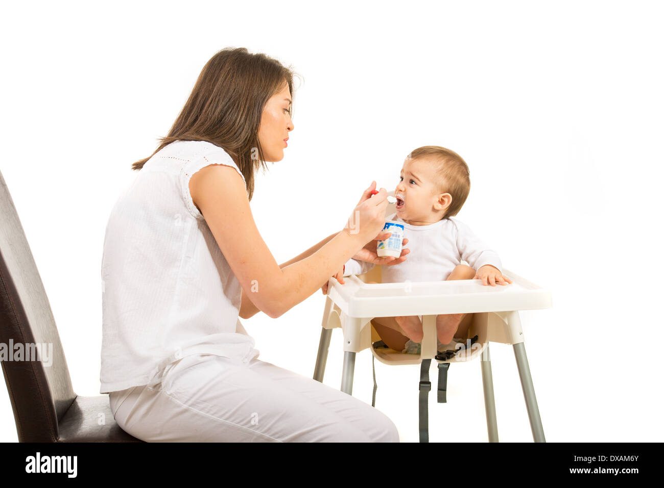 https://c8.alamy.com/comp/DXAM6Y/mother-feeding-toddler-boy-with-yogurt-against-white-background-DXAM6Y.jpg