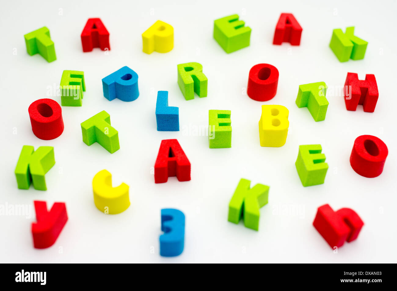 Letters of different colors on a white background Stock Photo - Alamy