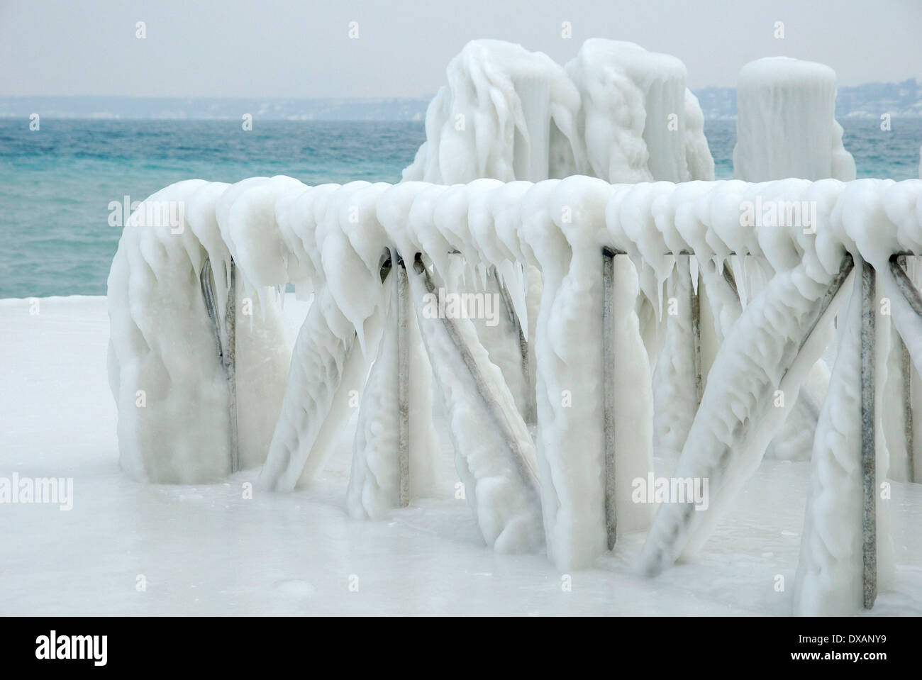 Handrail of landing stage covered with ice Stock Photo