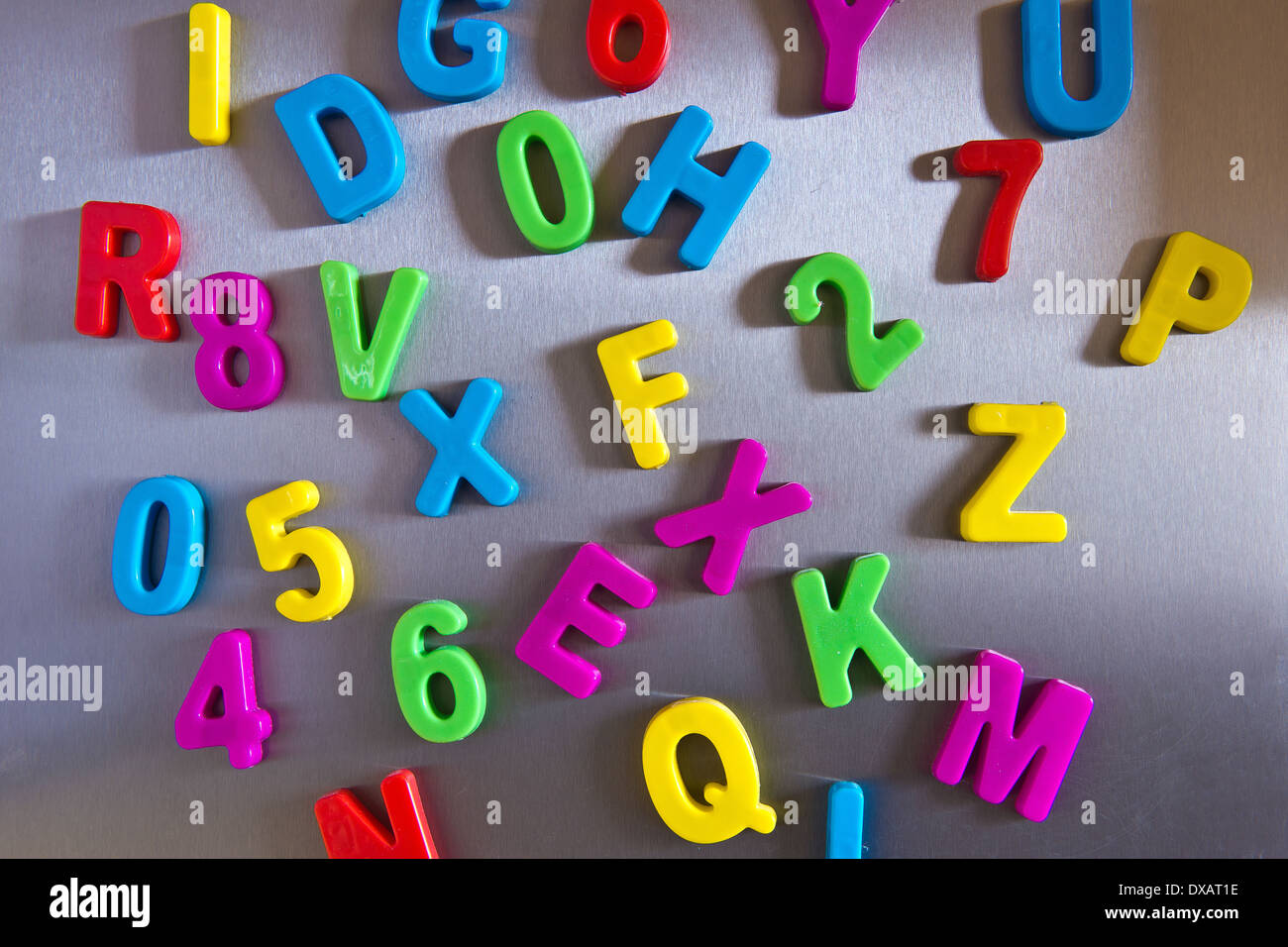 Colorful magnetic letters on refrigerator Stock Photo