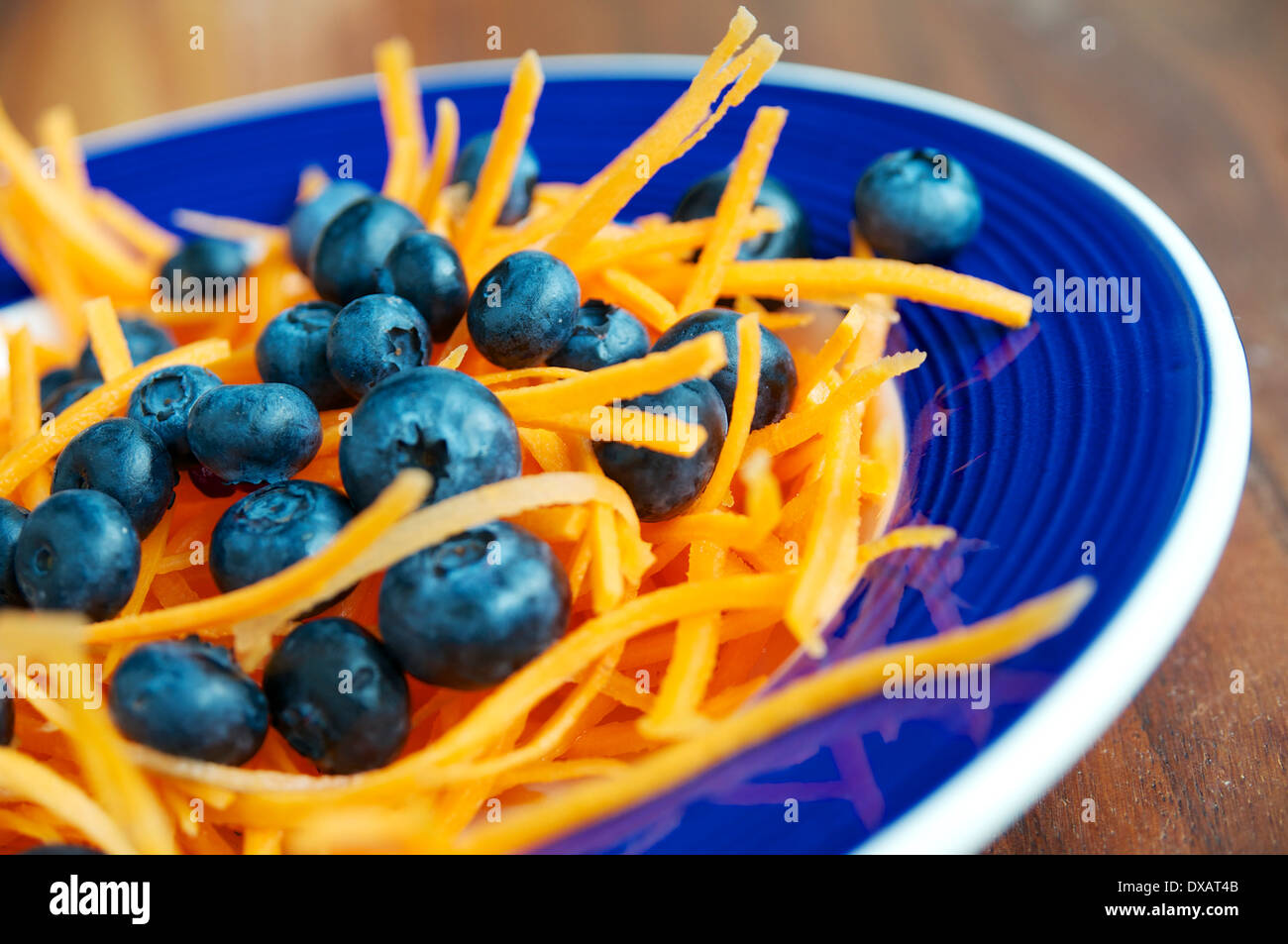 Bowl with a carrot and blueberry salad Stock Photo