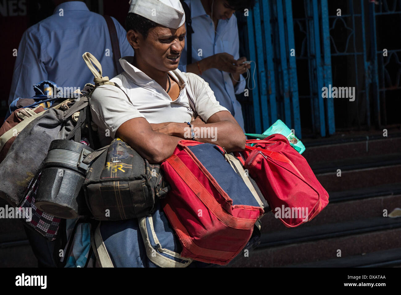 Dabbawala carrying Lunch Dabbas (Tiffin Boxes) for delivery to