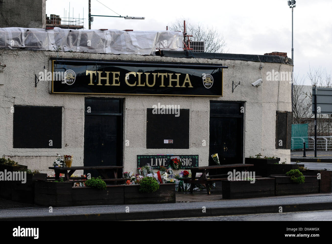 Several floral tributes have been place at the Clutha bar in Glasgow. A 10th victim of the accident has been announced. Stock Photo