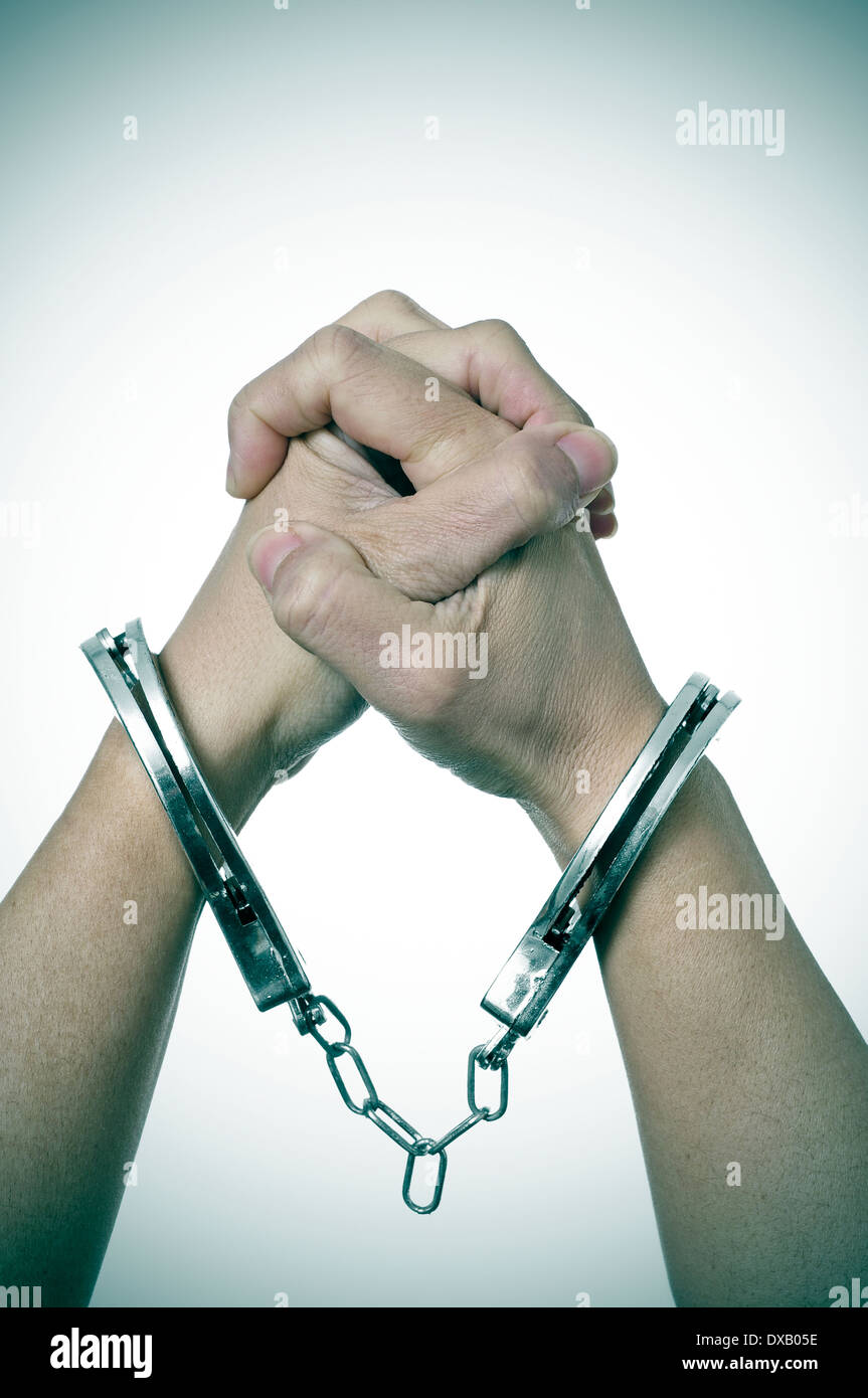 a woman with handcuffs in her wrists Stock Photo Alamy