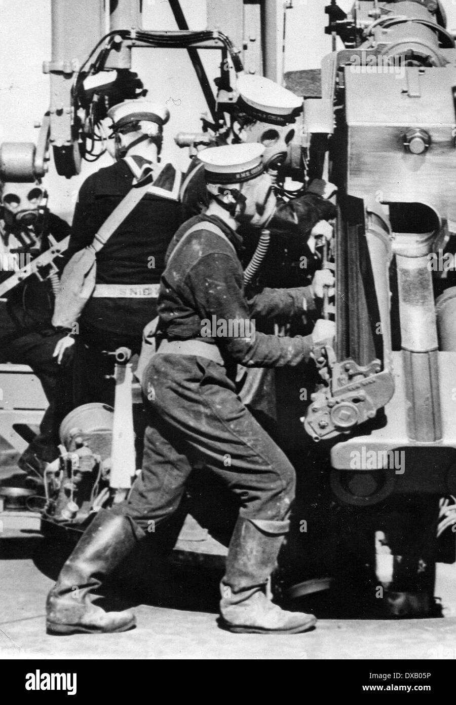 Royal Navy anti aircraft gunners in gas masks Stock Photo