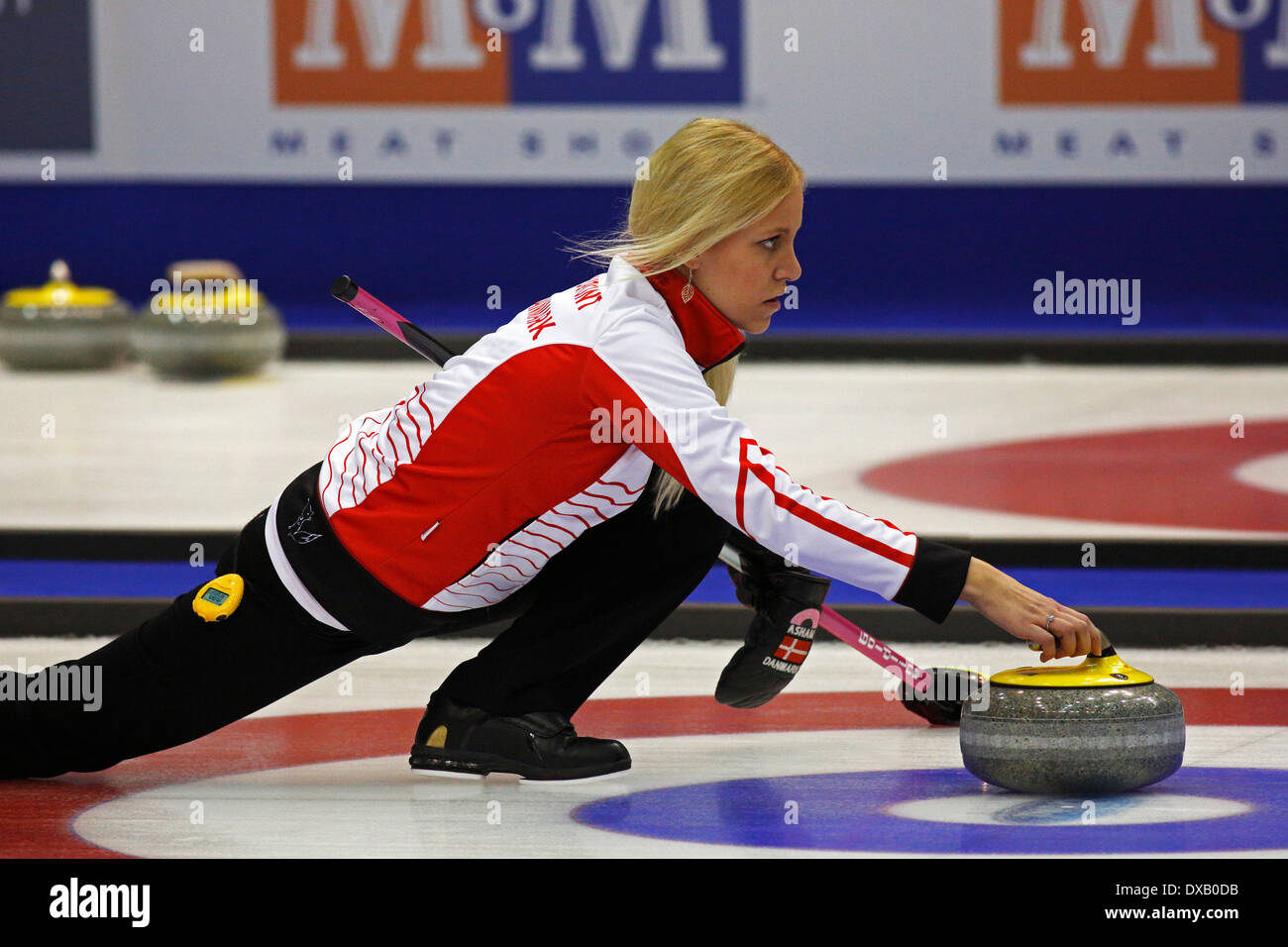 Madeleine Dupont of Denmark delivers a rock at the Ford World Women's Curling Championship March 19, 2014 in Saint John, Canada. Stock Photo