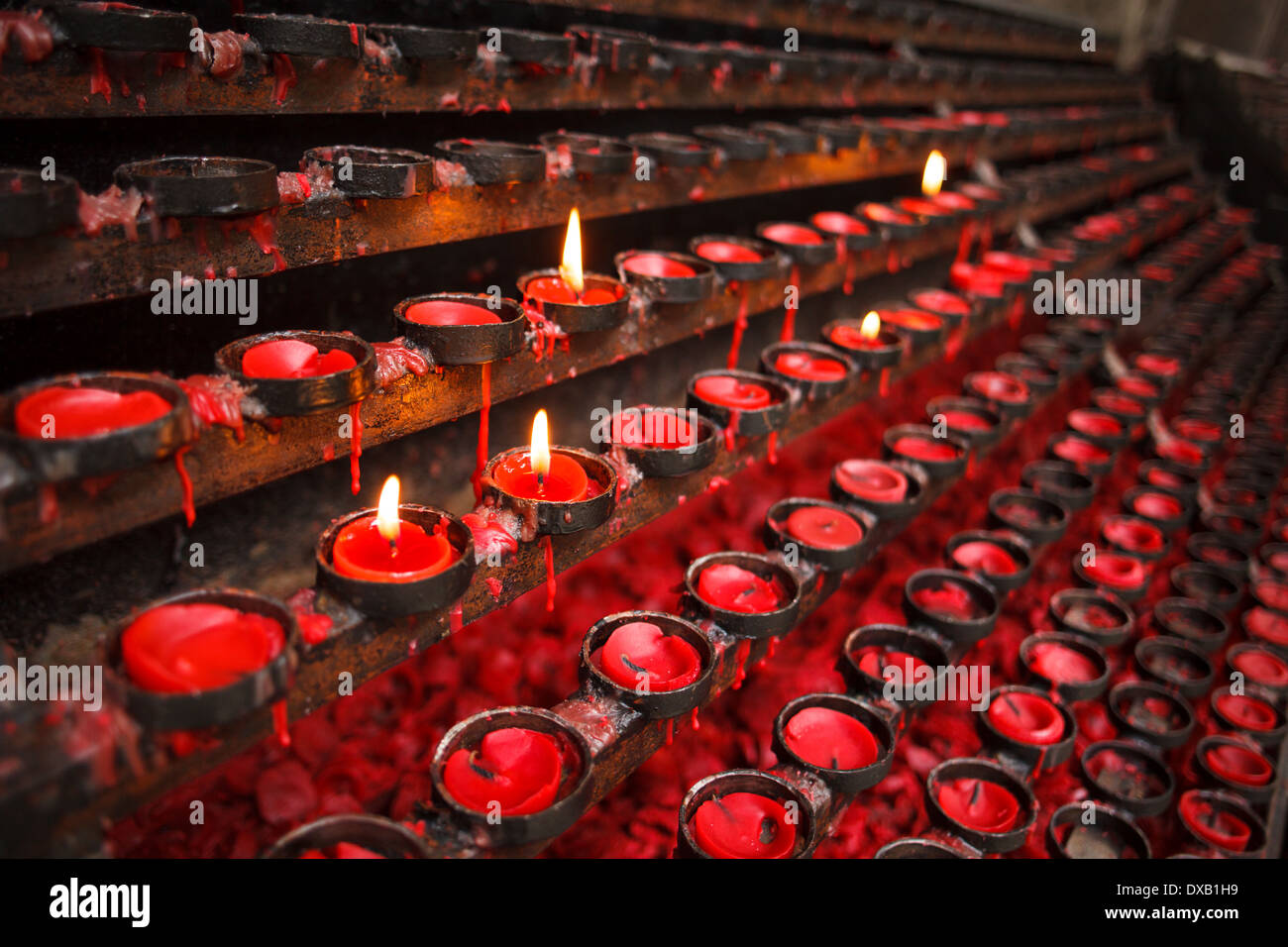 Red praying candles Stock Photo Alamy