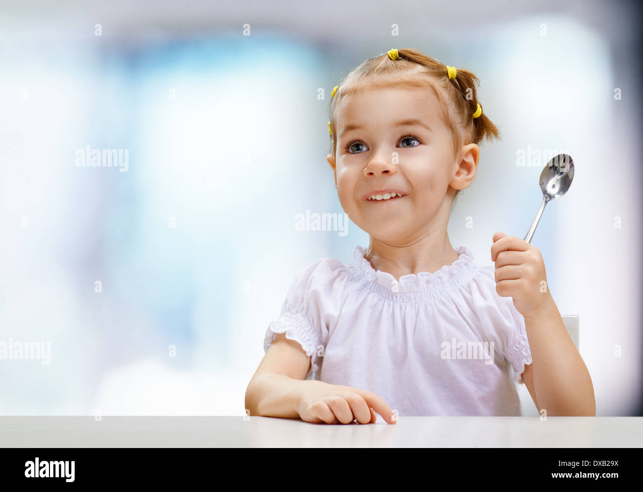 Little child spoon eating hi-res stock photography and images - Alamy