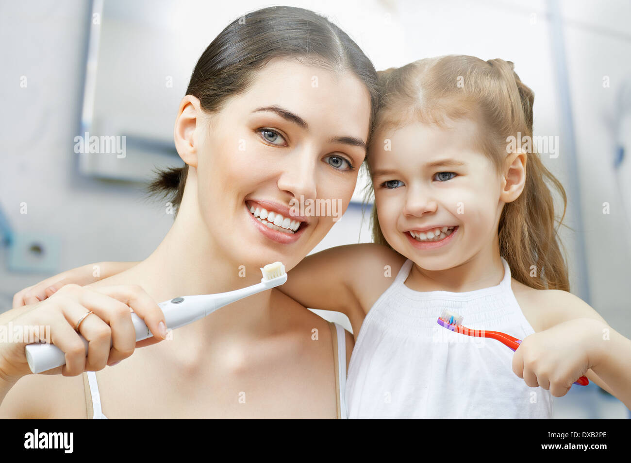 mother and daughter brush my teeth Stock Photo