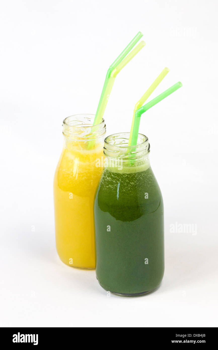 Freshly squeezed fruit and vegetable juices in small glass bottles. Stock Photo