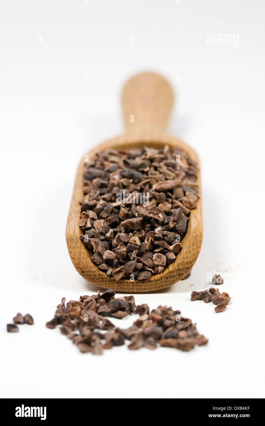 Single scoop of raw cocoa nibs Stock Photo Alamy