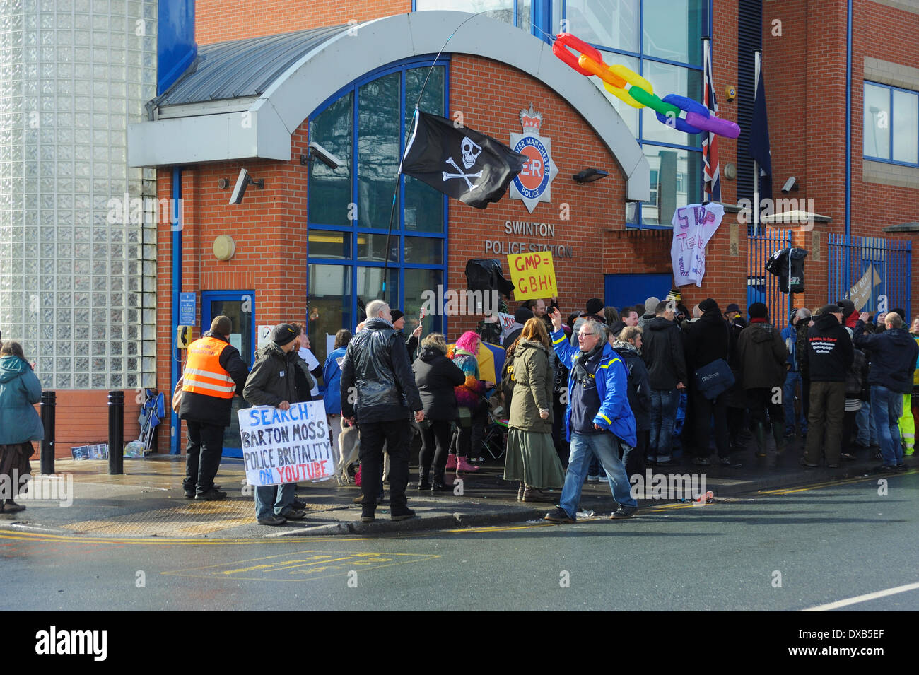 Swinton, Salford, Manchester, UK . 22nd March 2014. Anti-fracking campaigners protest outside Swinton police station, Salford, Manchester. Proyesters with their banners and flag congegate outside the entrance to the police station. Credit:  Dave Ellison/Alamy Live News Stock Photo