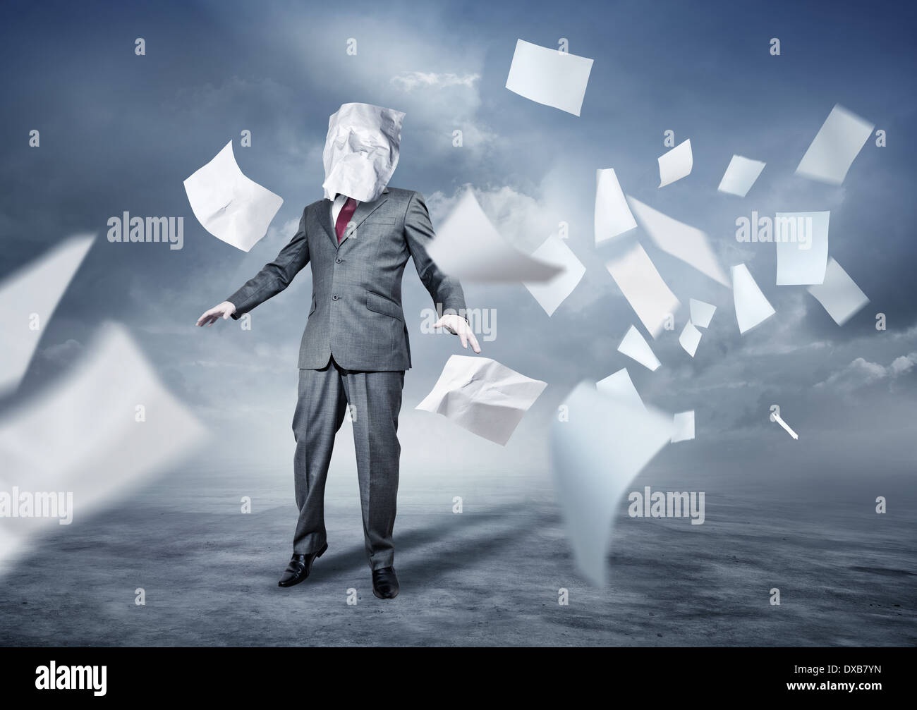 A businessman's face covered in paperwork. Business concept. Stock Photo
