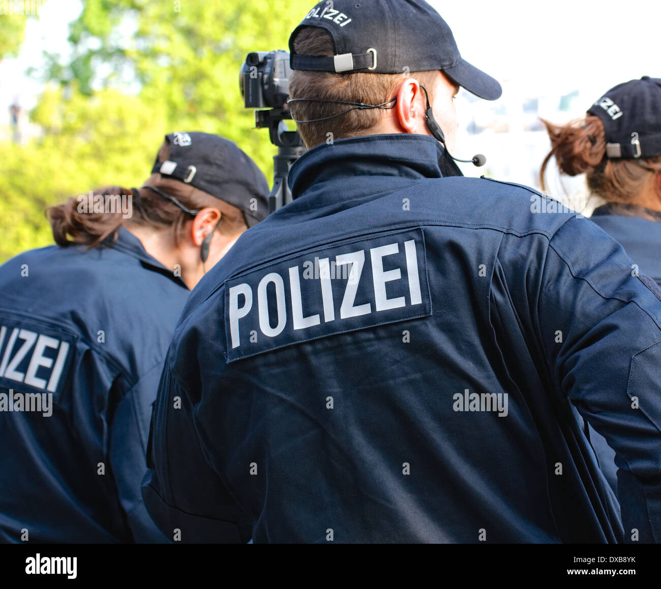 Group of German police officers seen from behind wearing uniforms marked  "Polizei" during May Day protests in Hamburg, Germany Stock Photo - Alamy