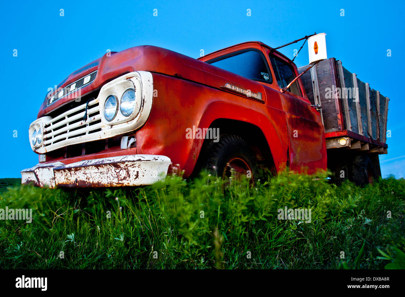 A farm truck stands where it was abandoned in a field in the middle of nowhere on the prairie west of Cochrane, Alberta, Canada. Stock Photo