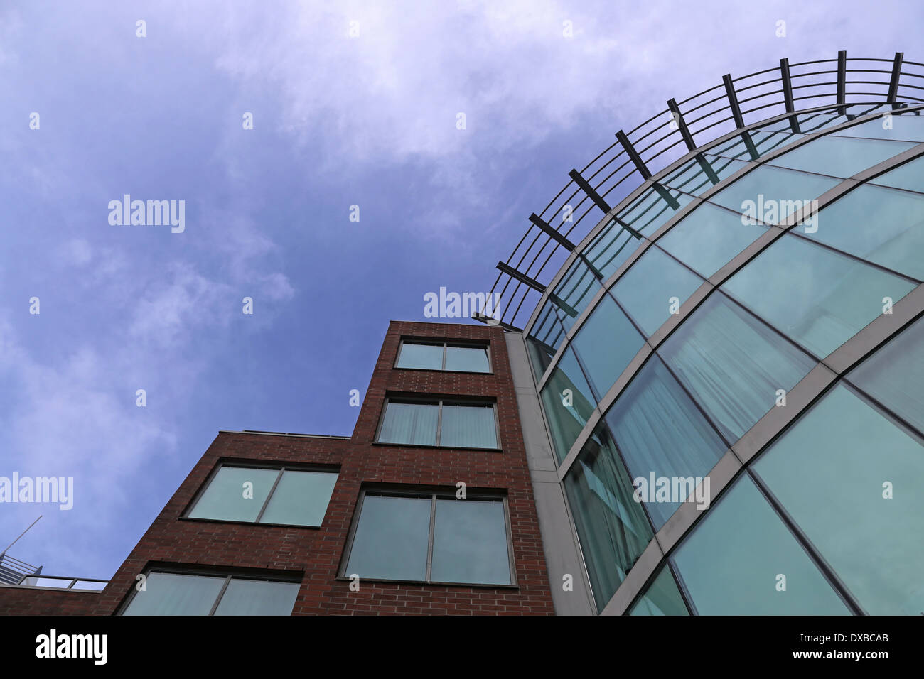Business building against blue sky Stock Photo - Alamy