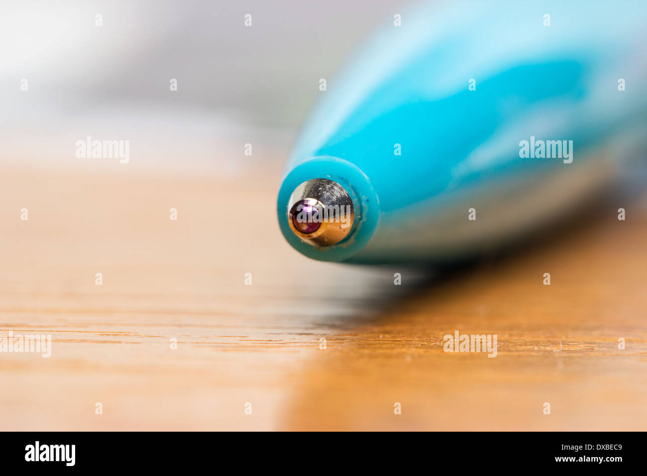 Blue ball pen on a table in macro scale Stock Photo