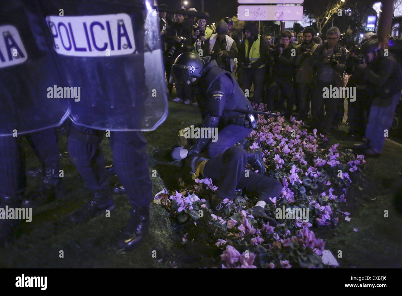 Madrid, Spain. 22nd Mar, 2014. riot police arrest a protestor during a ...